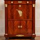 Rare four-column secretary from the Empire period in flame mahogany and bronze.