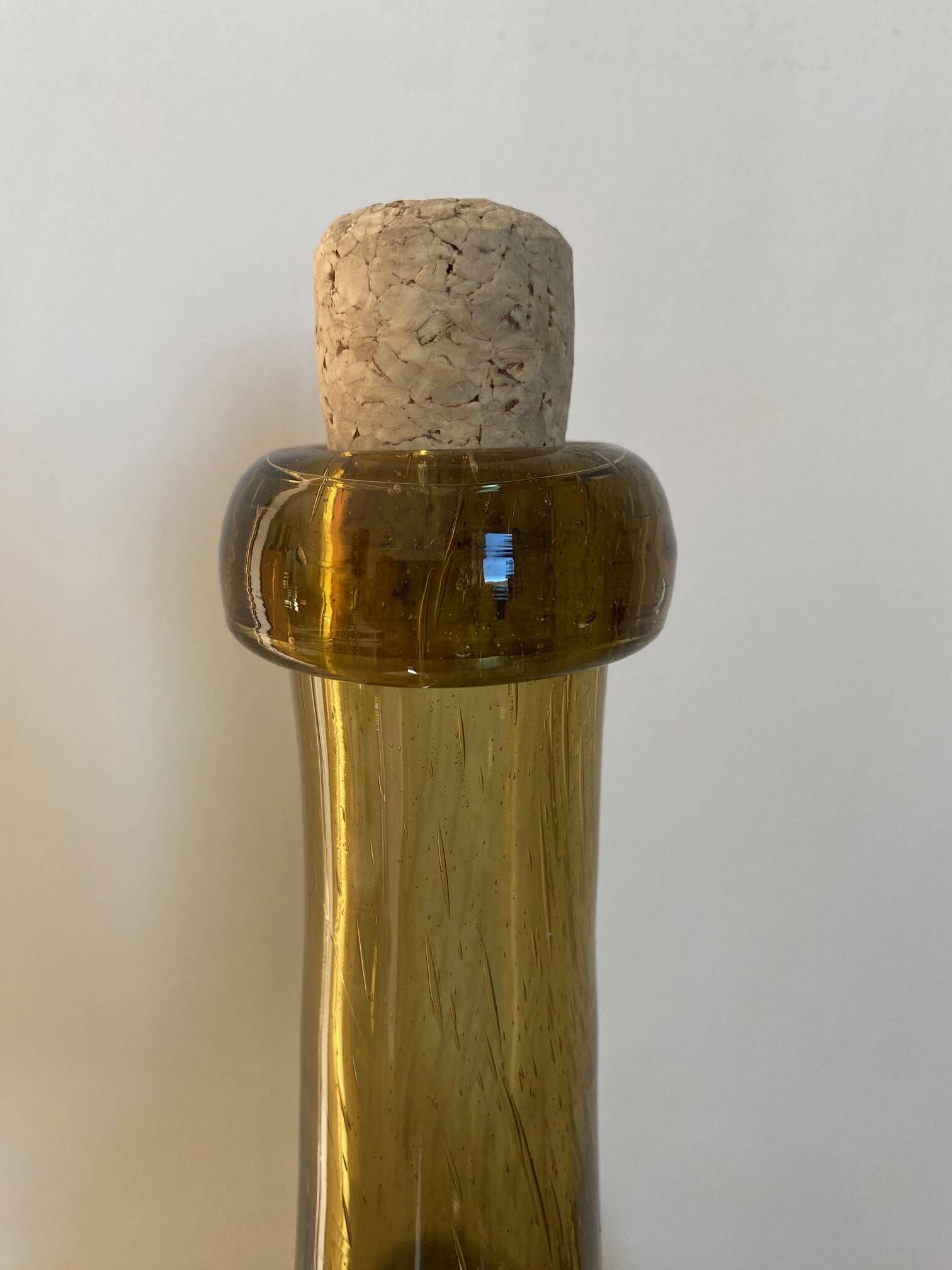 Amber colored Biot bubble glass bottle