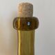 Amber colored Biot bubble glass bottle