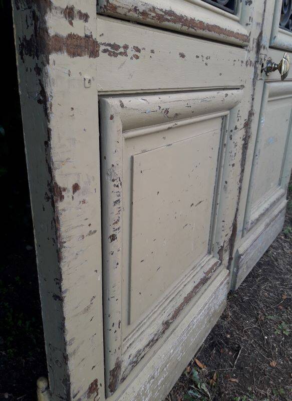 19th century double arched entrance door in oak with grilles and old glass