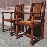 Pair of oak armchairs with straw seats and backs.