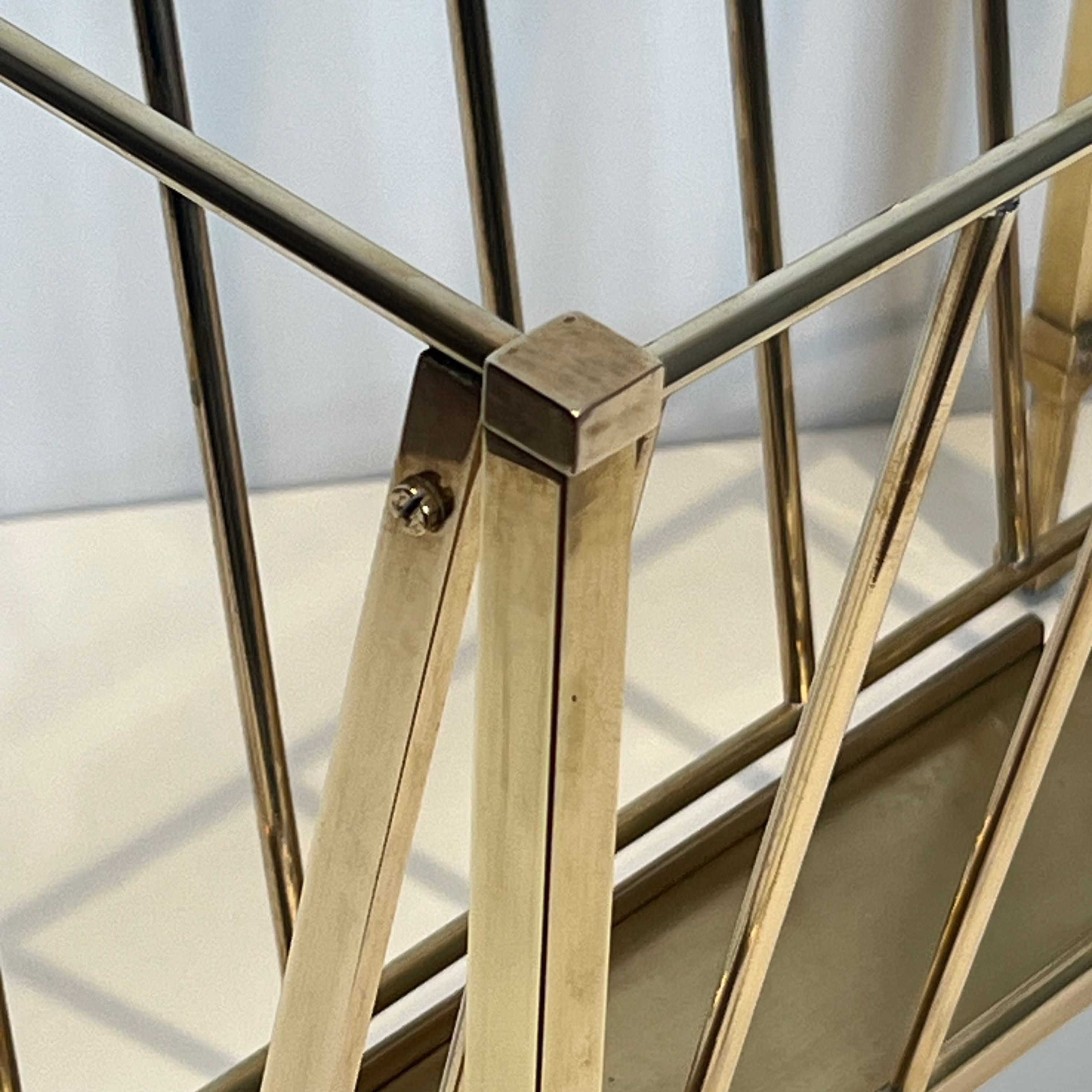Neoclassical brass magazine rack attributed to Maison Ramsay.