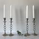 Four twisted silver candlesticks