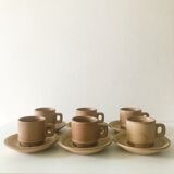 Stoneware coffee cups with saucers