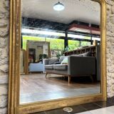 Louis-Philippe mantel mirror 133cm/115.5cm beaded gilded with gold leaf geometric decoration, late 19th century, heavily pitted and scratched glass, parquet on the back.