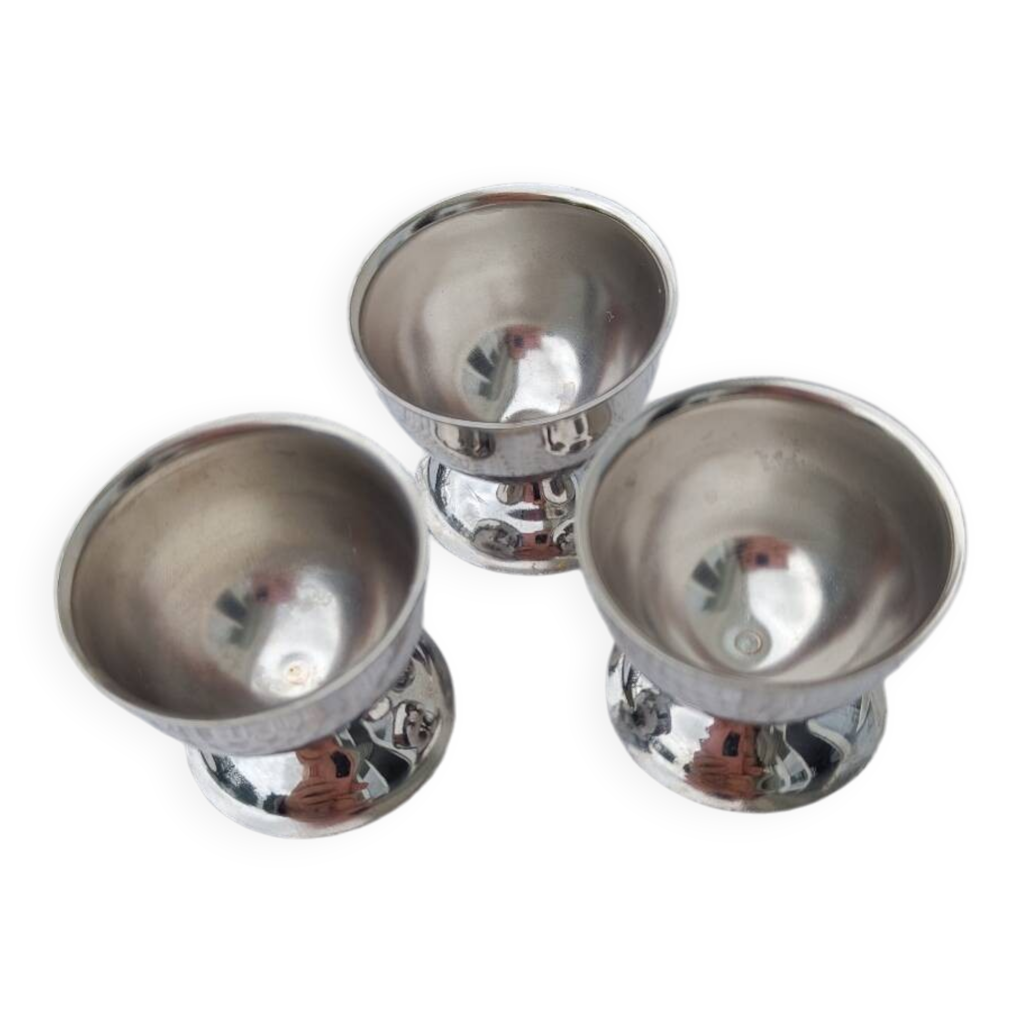 A set of 3 egg cups by Guy Degrenne.
