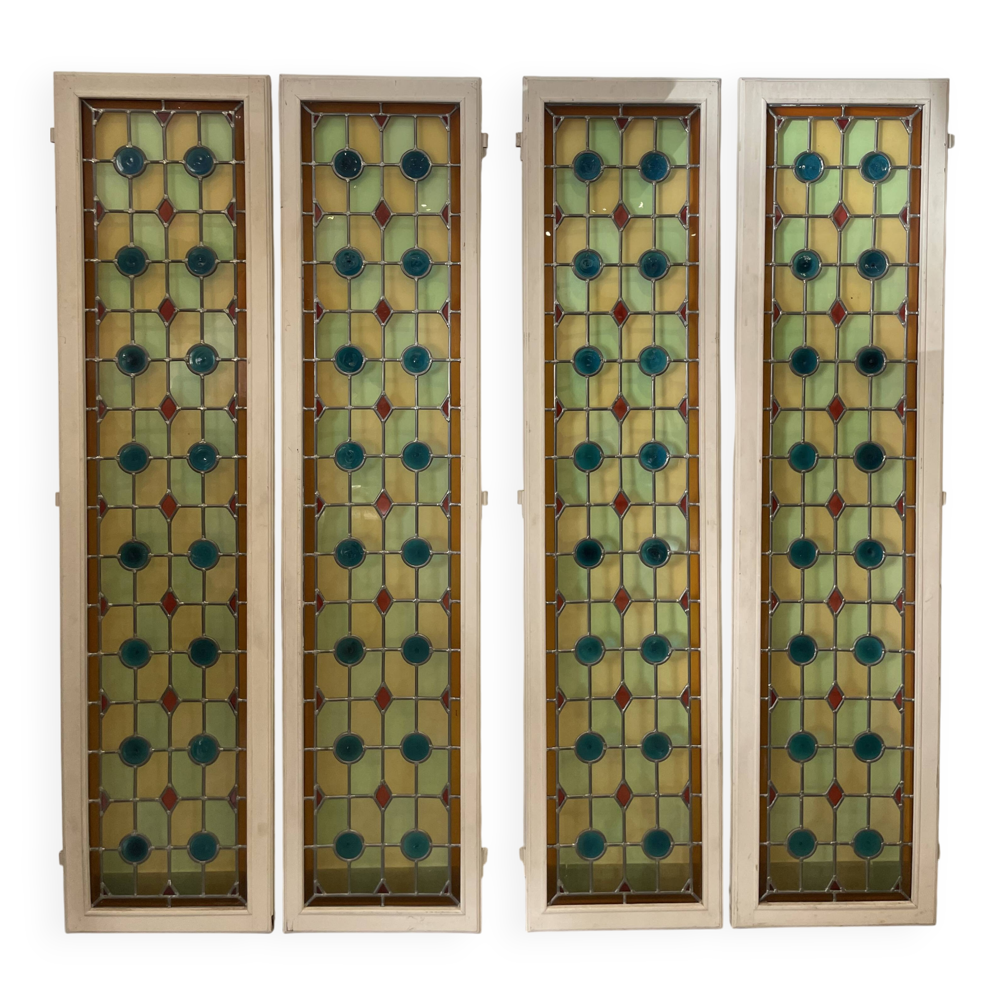4 vintage faux stained glass panels that can form a screen or a partition