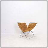 Chrome metal magazine rack with woven banana leaves