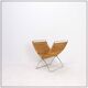 Chrome metal magazine rack with woven banana leaves