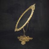 Swivel table mirror in golden metal
