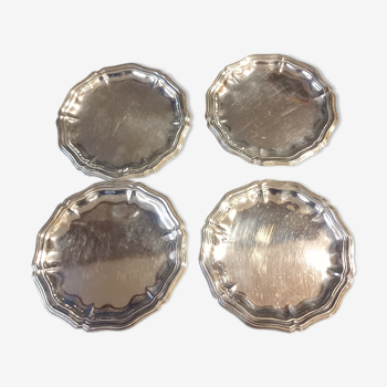 Four silver metal bottle bottoms