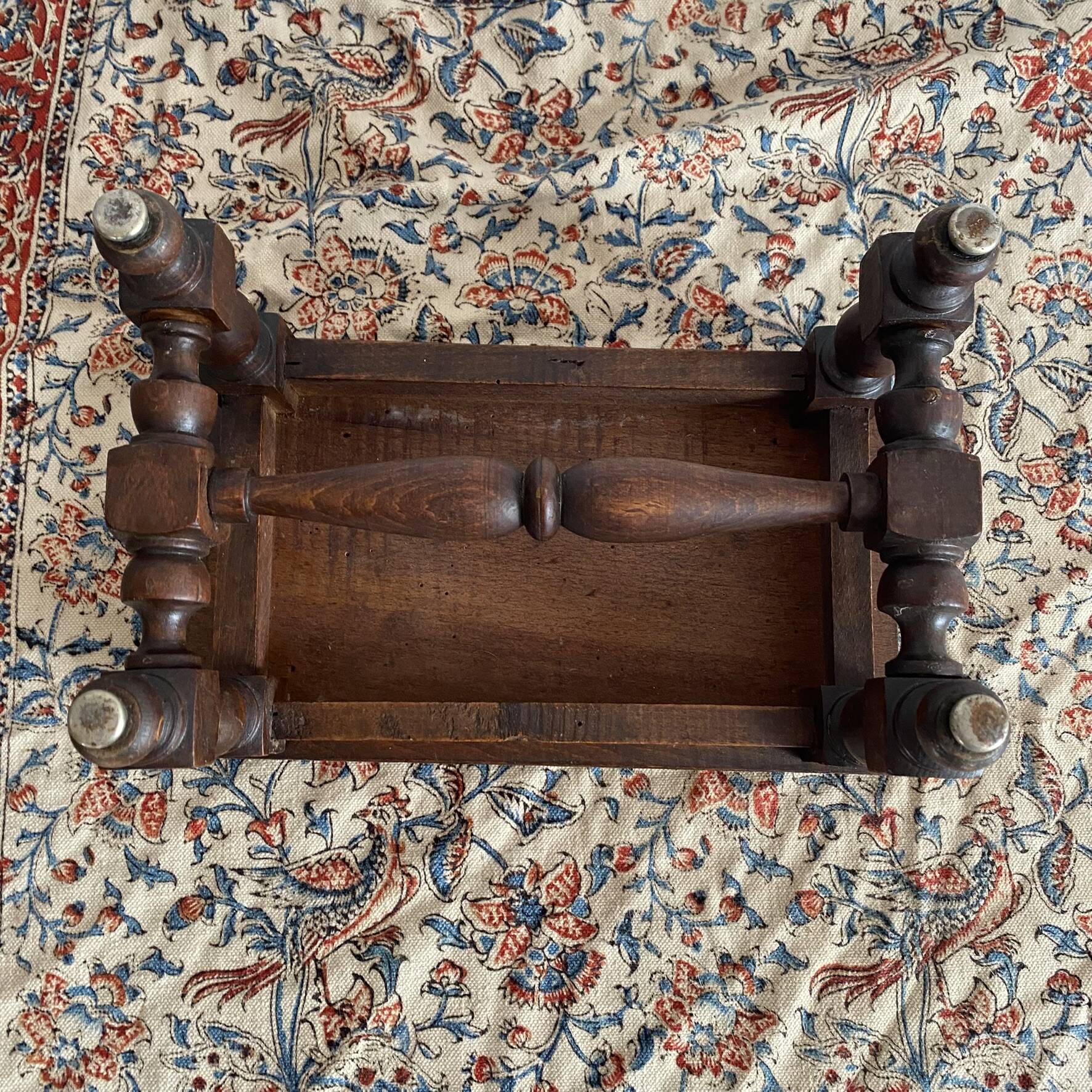 Low stool in carved wood