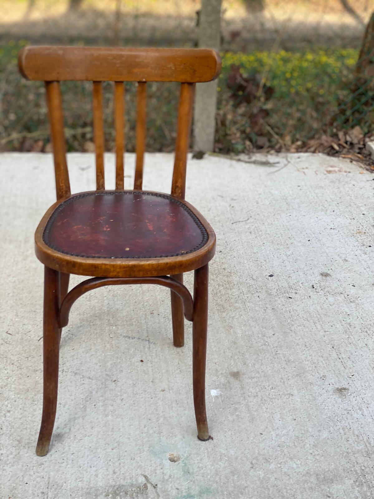 Bentwood bistro chair upholstered in burgundy leather