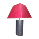 Ovoid lamp sheathed in braided blue leather and saddle stitching