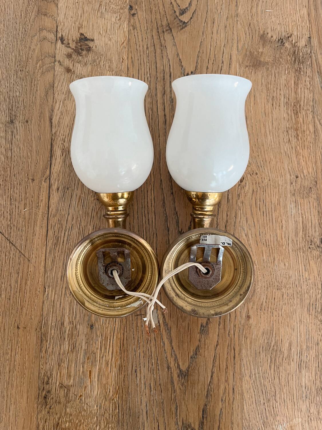 Set of 2 golden, bronze and brass torch wall lights