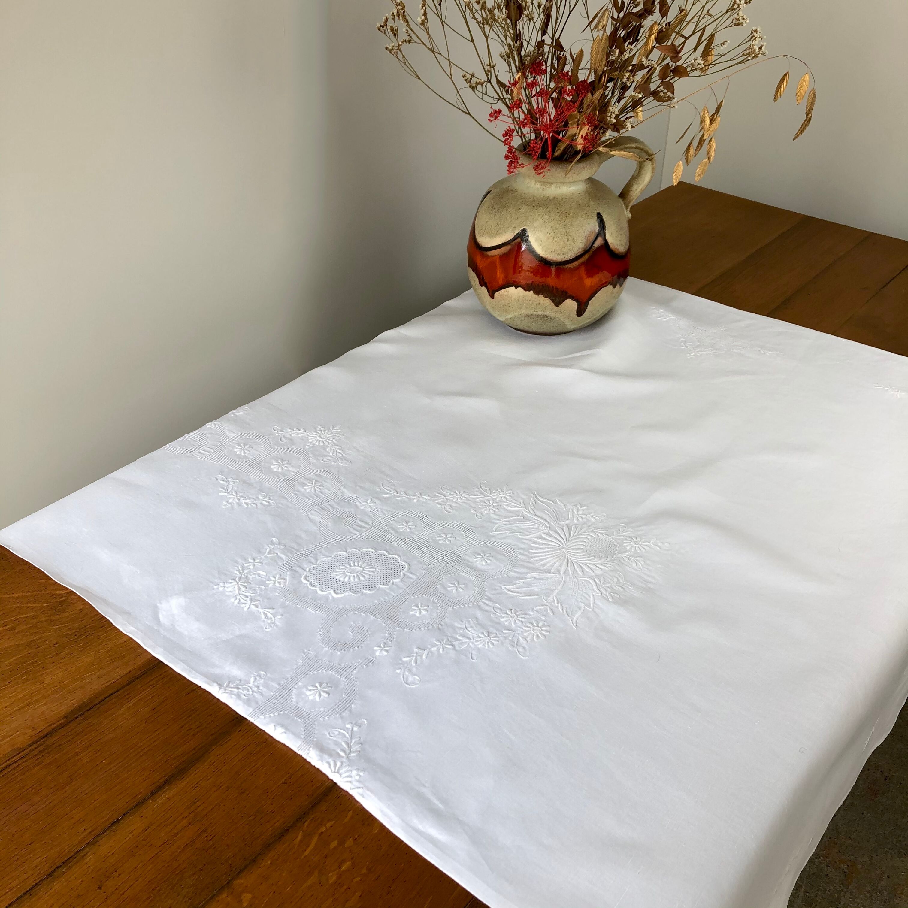 White coat embroidered floral patterns