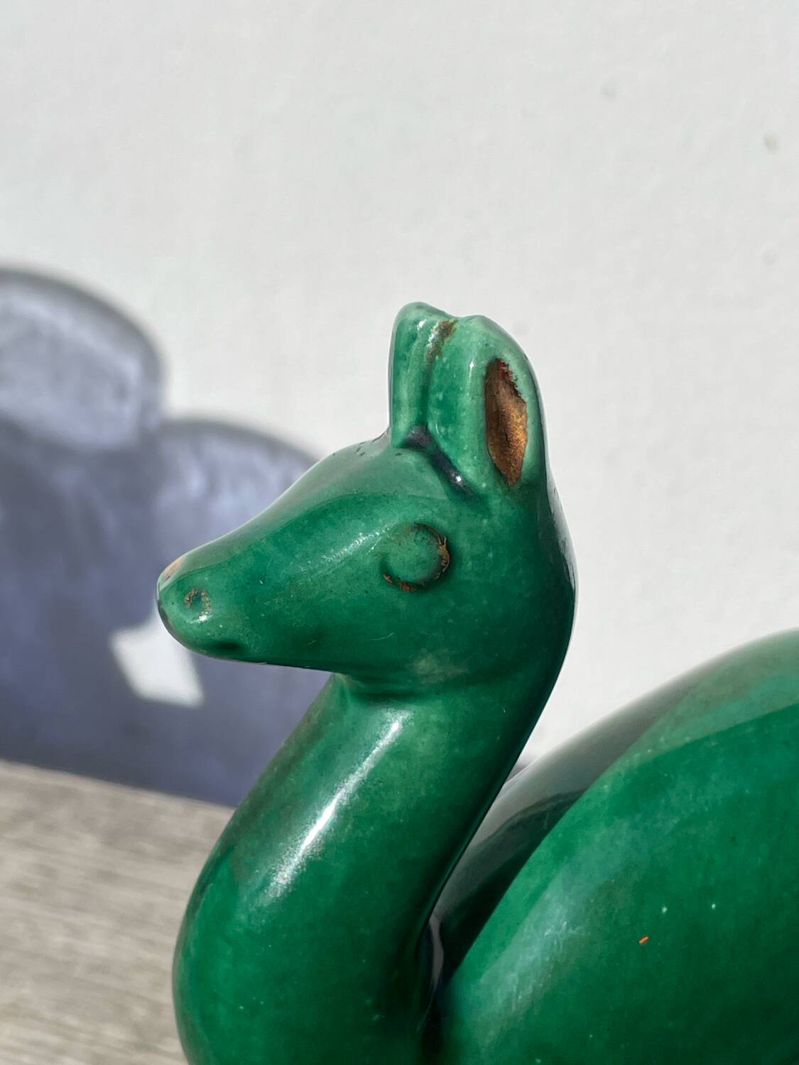 Art Deco figurine of a green ceramic doe