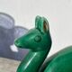 Art Deco figurine of a green ceramic doe
