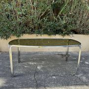 Vintage curved rectangular dining table in smoked glass and metal.