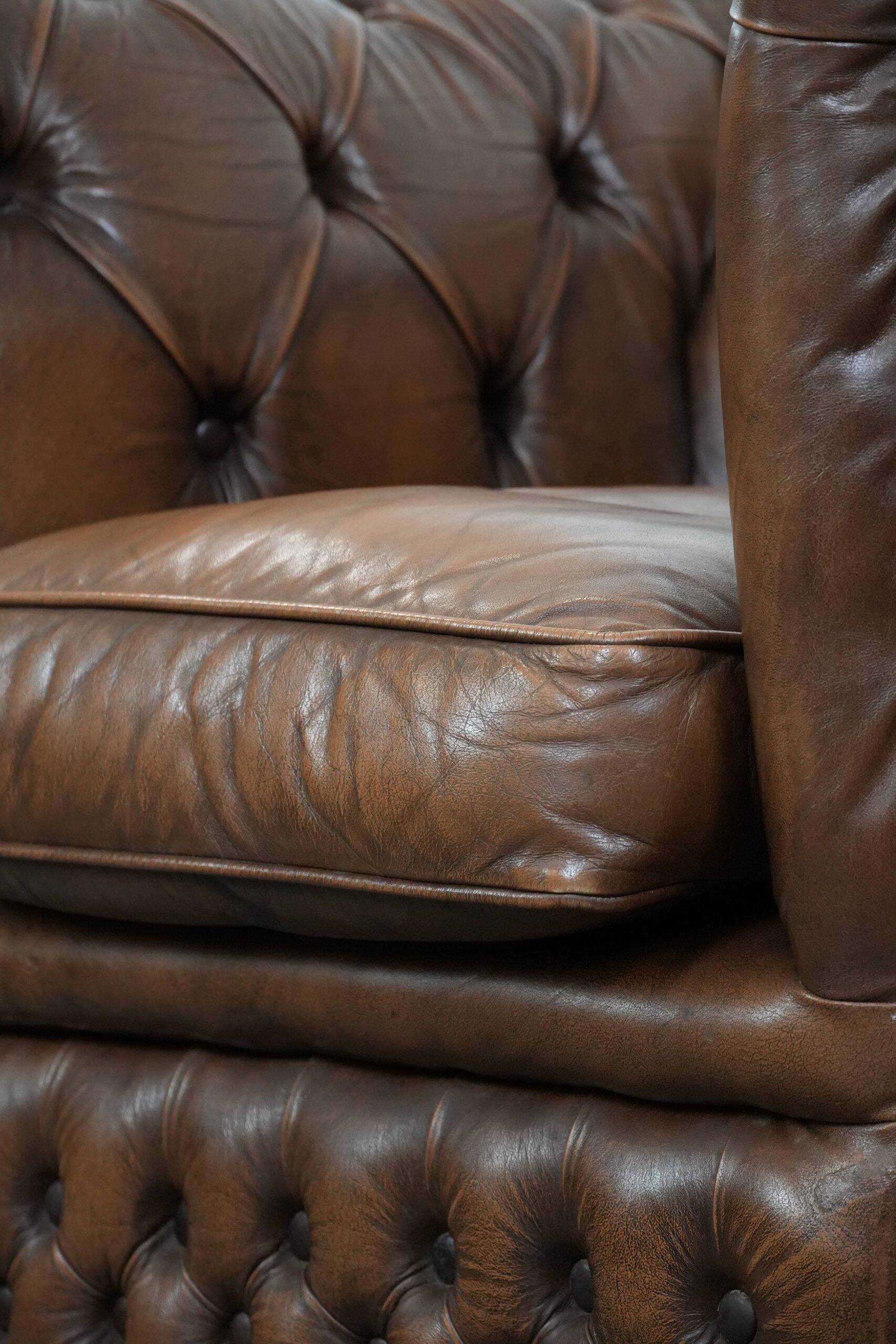 Brown cowhide leather chesterfield armchair  in English style on wheels