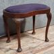English piano stool in Louis XV style made of mahogany in a bean shape.