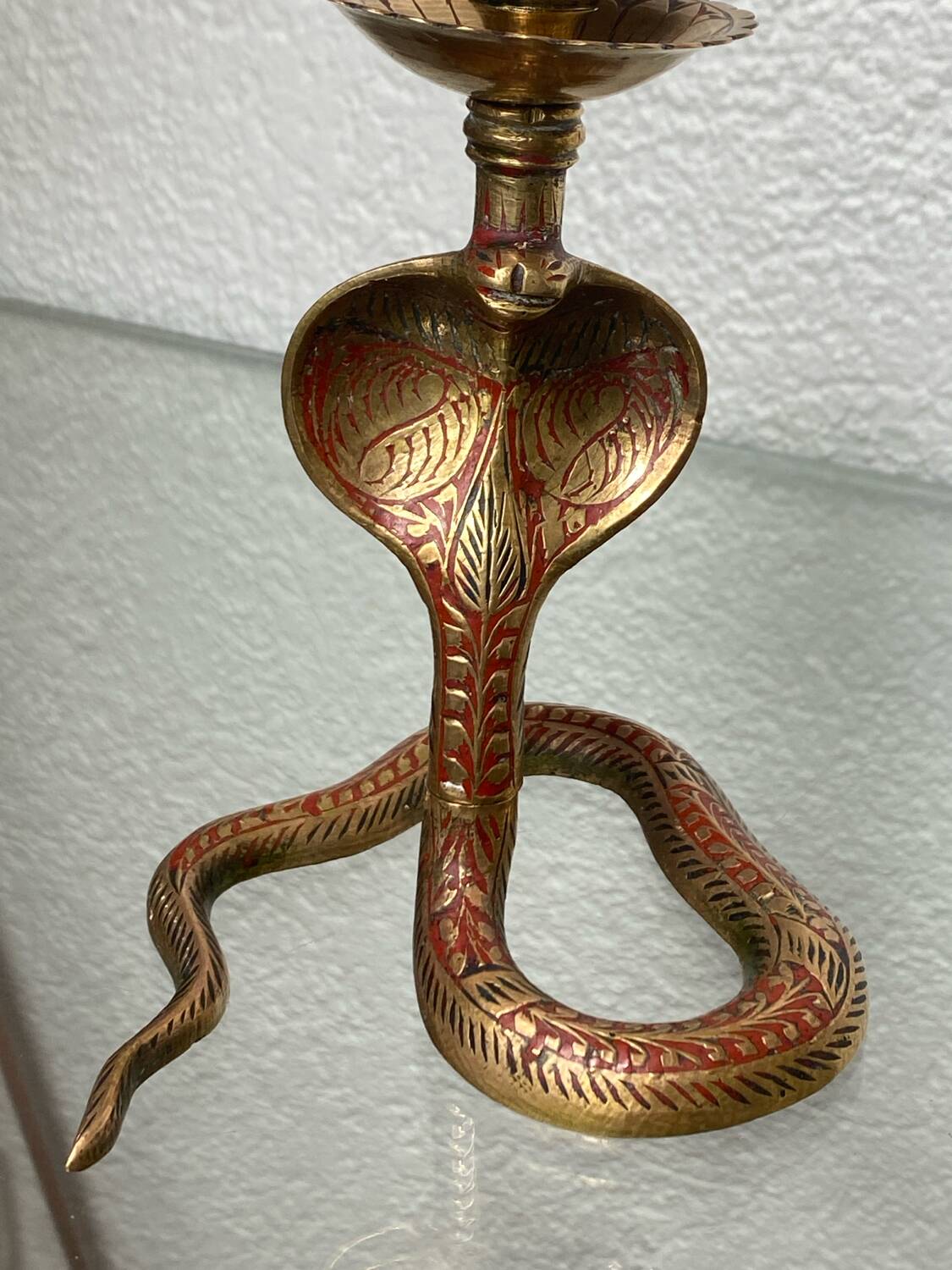 Chiseled brass cobra candlestick