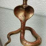 Chiseled brass cobra candlestick