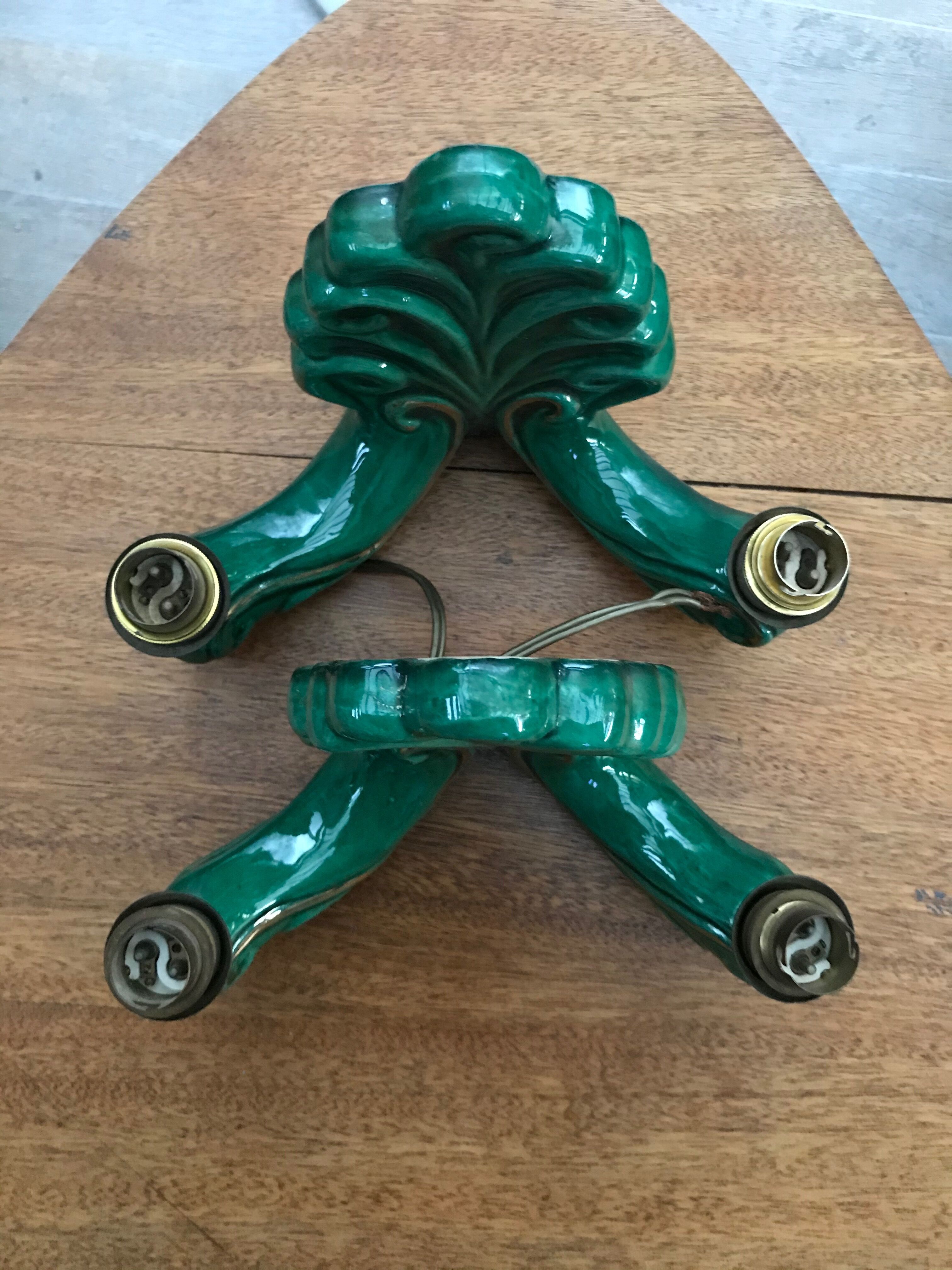 Former pair of art deco green ceramic wall sconces