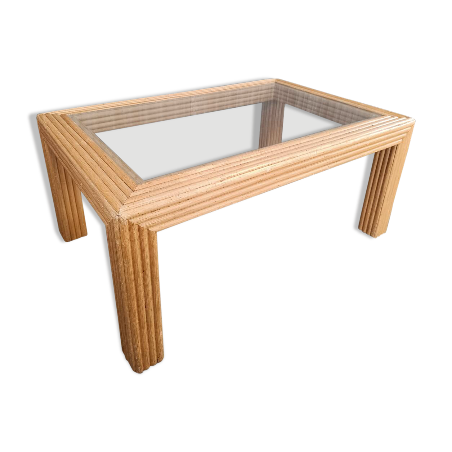Glass coffee table in rattan/bamboo