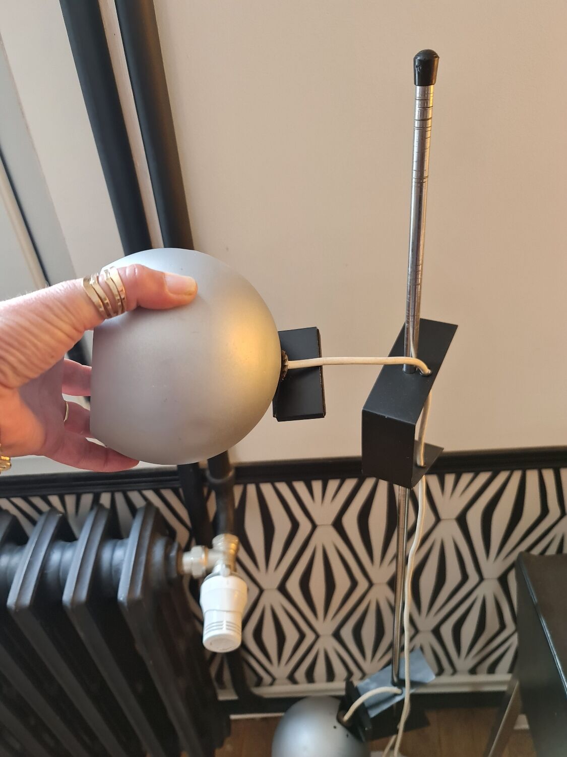 Two-light floor lamp with removable magnetic Eyes Ball.