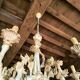 Florentine chandelier in carved wood with polychrome patina.