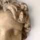 Plaster bust on a wooden base