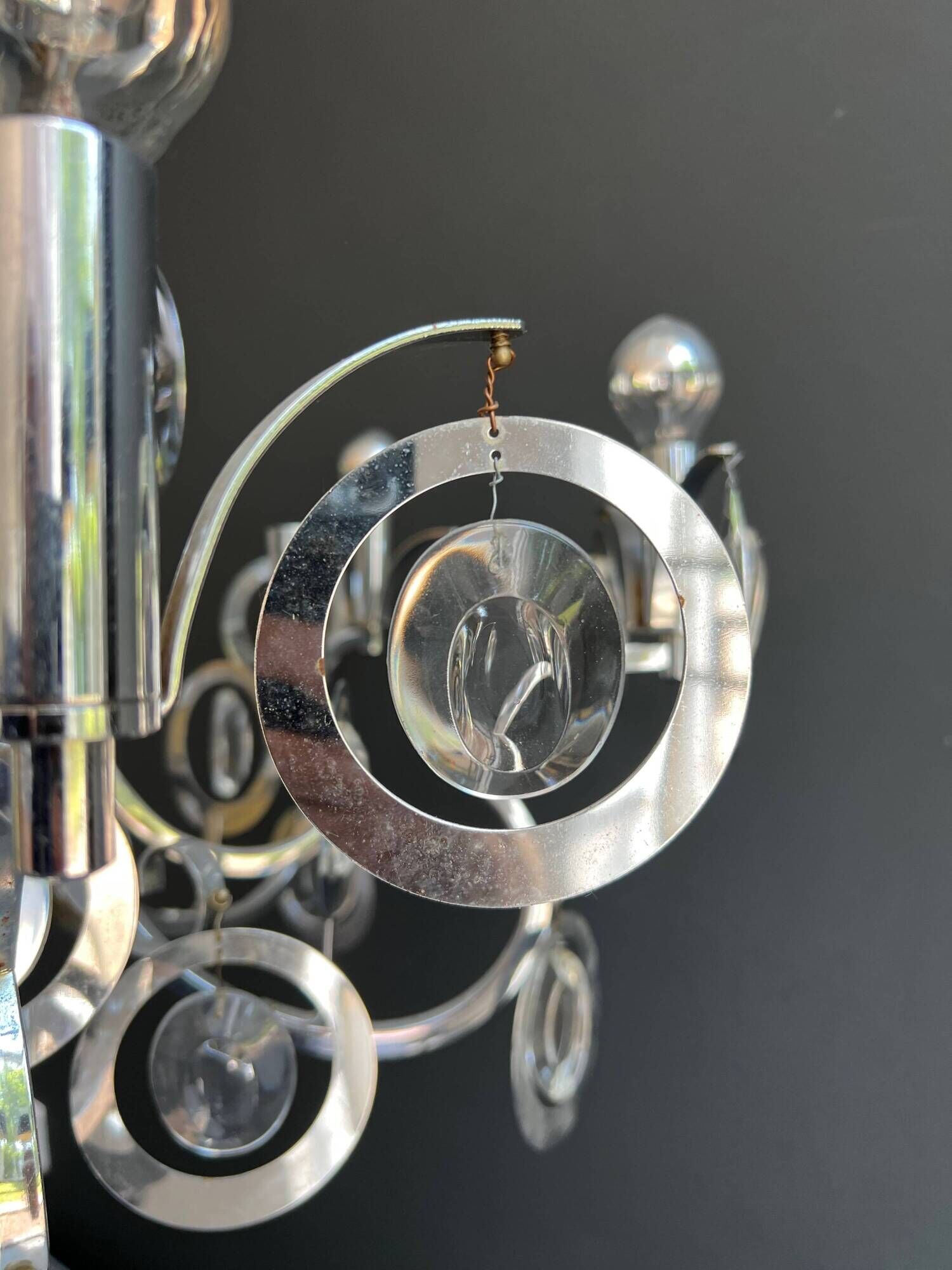 Chrome Metal Design with Swirls and Optical Glass Lenses. Tra