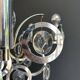 Chrome Metal Design with Swirls and Optical Glass Lenses. Tra