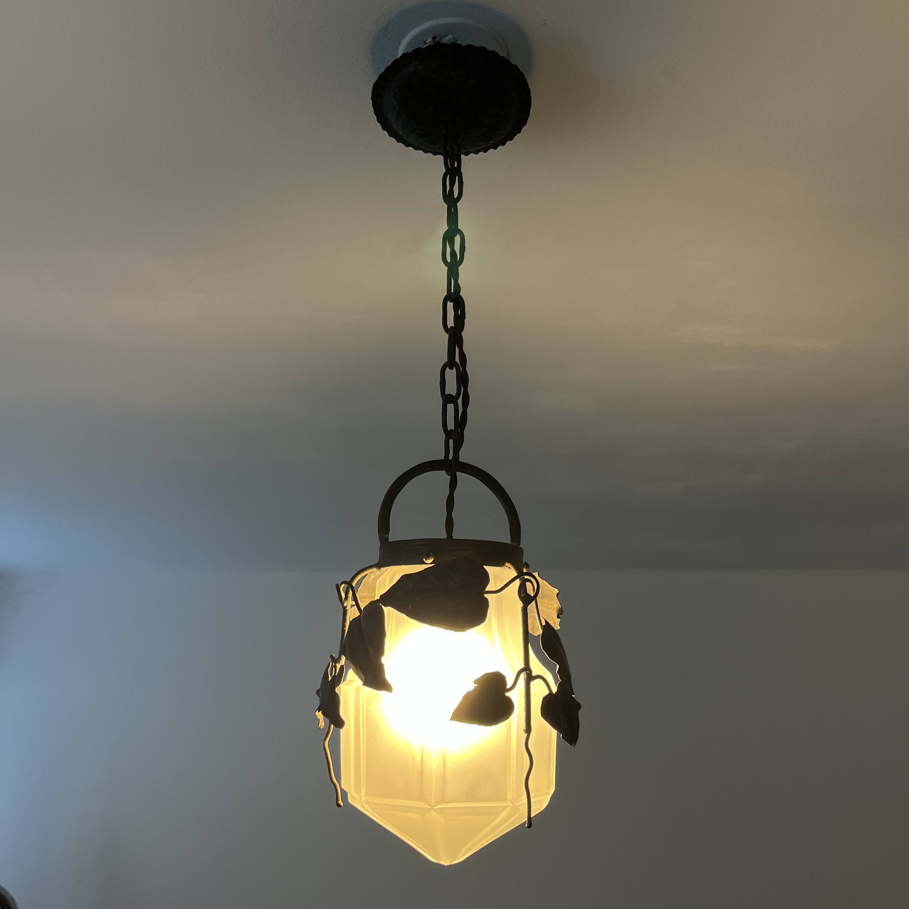 Antique glass and wrought iron pendant light with ivy decor Art Deco chandelier globe