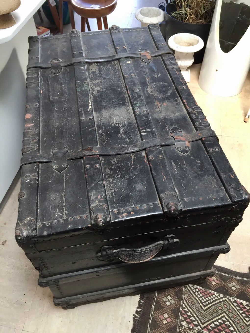 Black ancient travel trunk, 19th