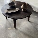 Coffee table, round antique Indonesian teak table with straight legs.