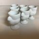 Six white hen egg cups