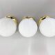 Set of three mid-century brass and milk glass ceiling ligts, restored