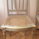 Pair of Louis XVI caned chairs with carved gilded wood.