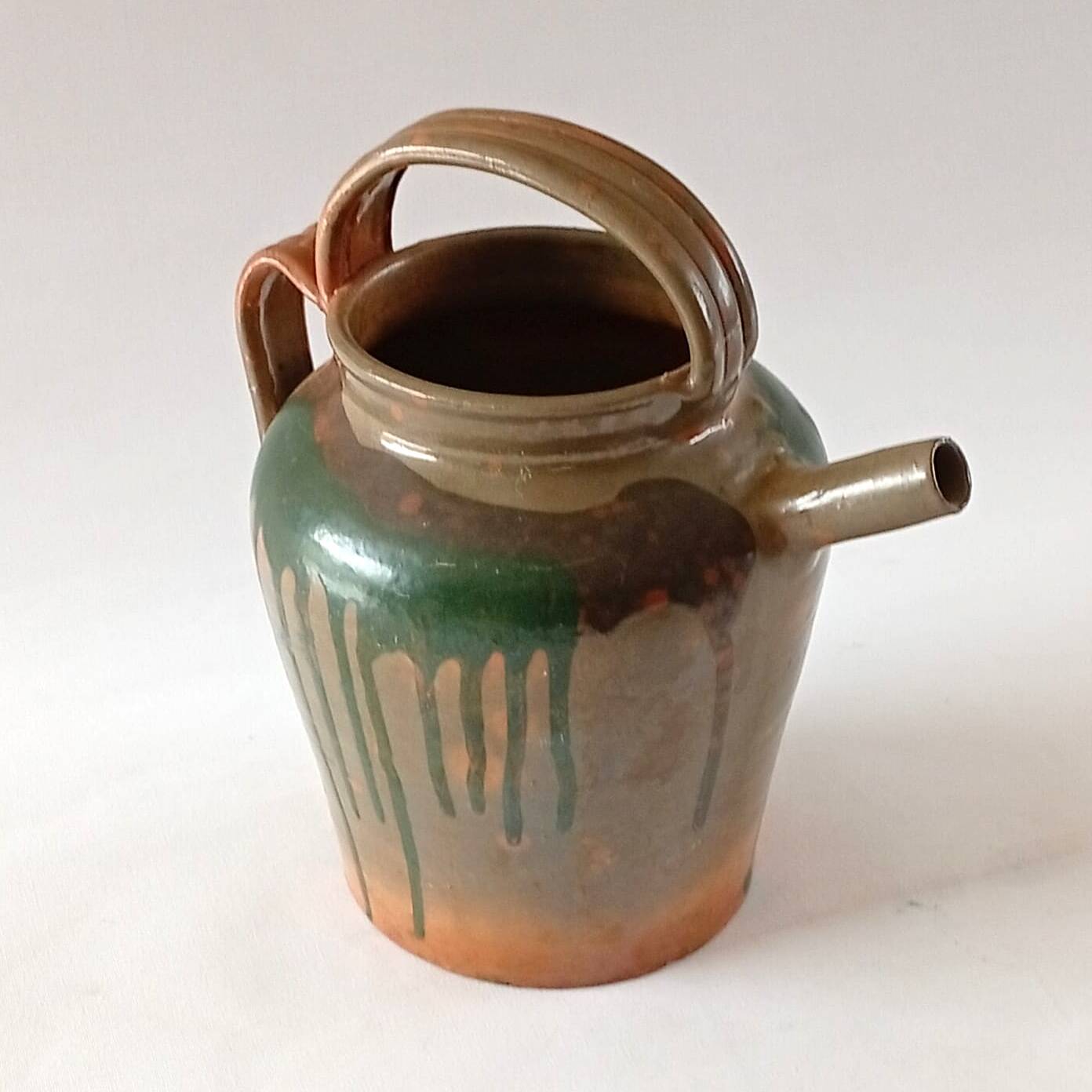 Glazed stoneware jug with drips
