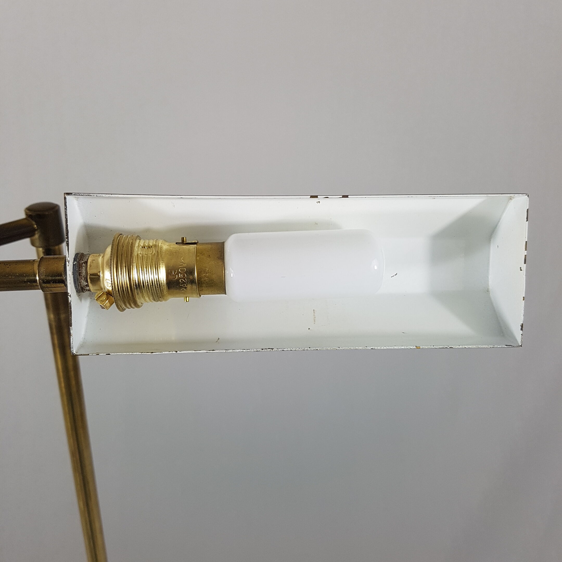 Articulated brass floor lamp