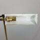 Articulated brass floor lamp