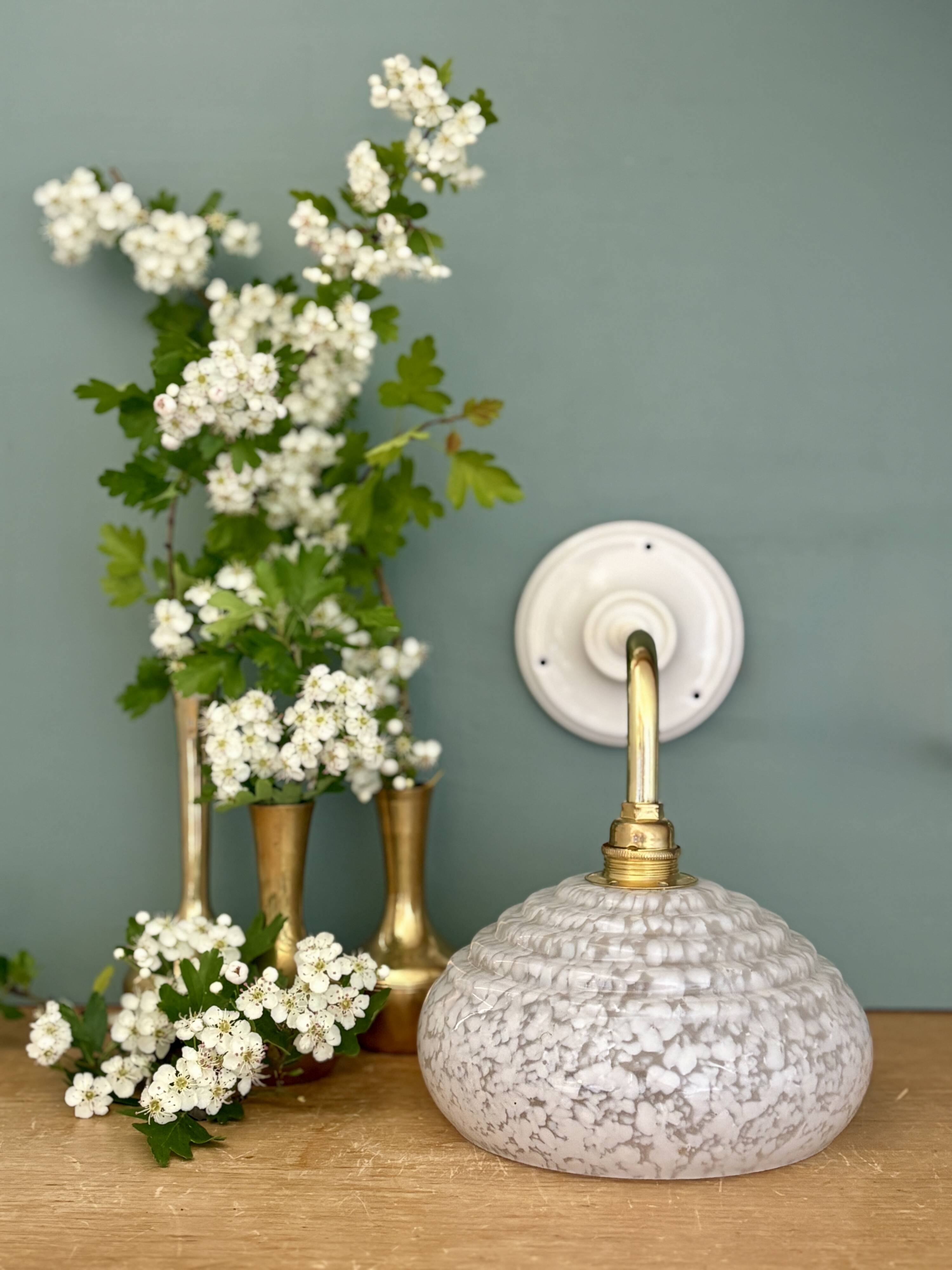 Vintage glass wall lamp with a white Clichy shade.