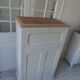 Small vintage piece of furniture sublimated in a linen shade, wooden top.