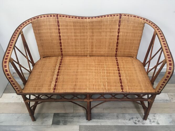 Braided rattan sofa and red edging