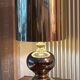 Beautiful ceramic base lamp with a golden metal shade.