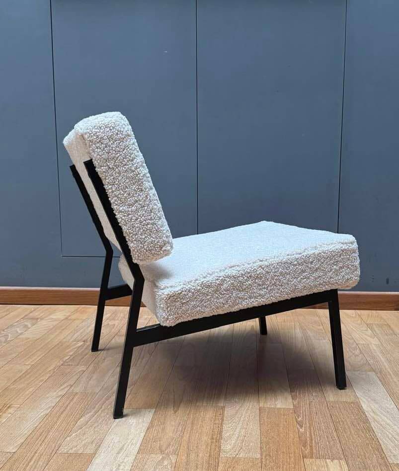 Pair of vintage armchairs, black metal and sheepskin fabric, France 1950.