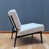 Pair of vintage armchairs, black metal and sheepskin fabric, France 1950.