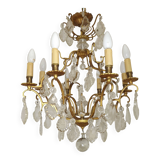 French Louis XV chandelier with 8 lights in gilded bronze, glass and crystal.